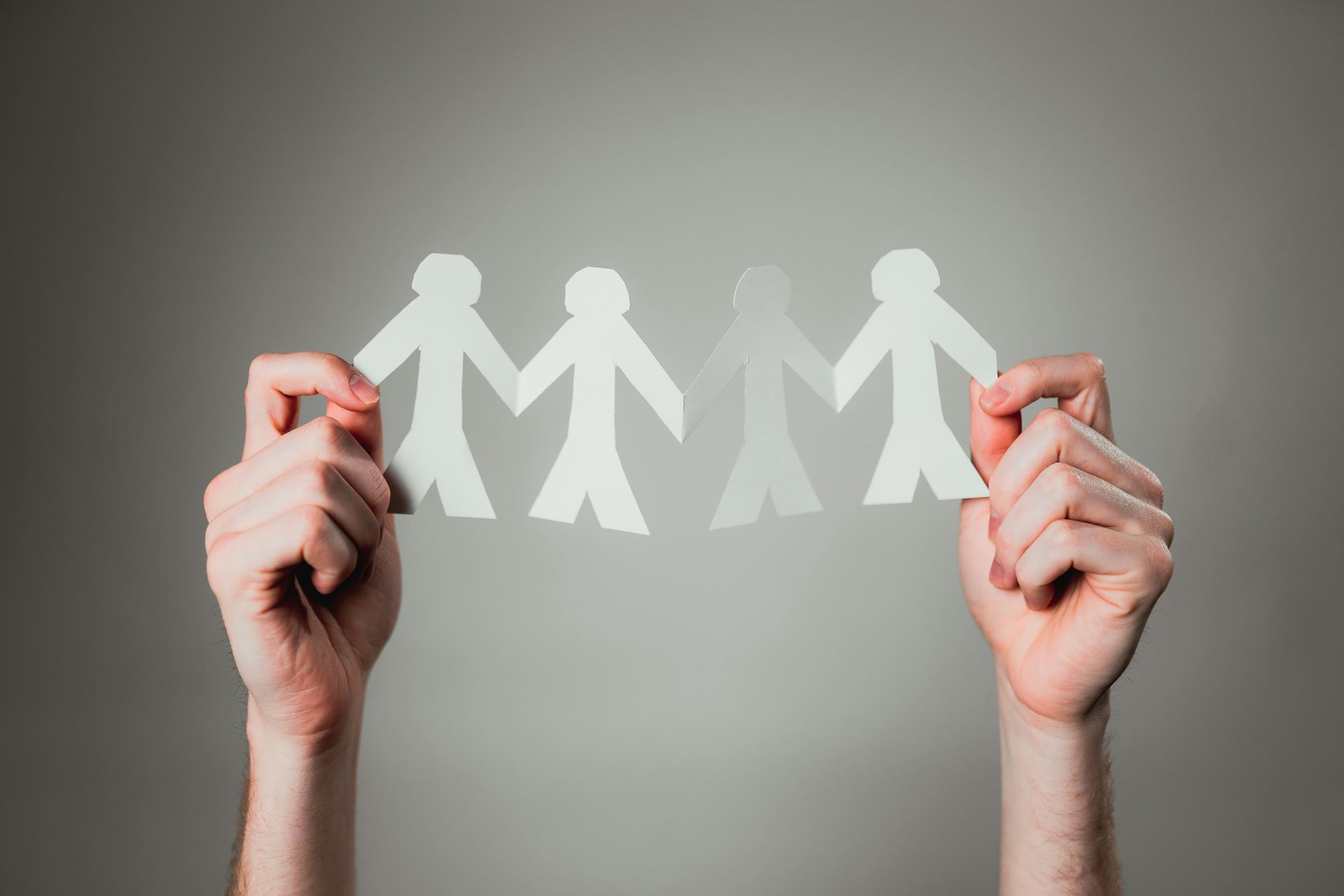 Paper cut outs of people